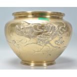 A 20th Century Japanese brass bowl of bulbous tapering form having raised dragon decoration to the