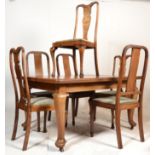 A late 19th century oak extending dining table raised on cabriole legs with pad feet and castors