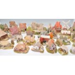 A large collection of various Lilliput Lane cottages to include Flower Sellers, Downegal Cottage,