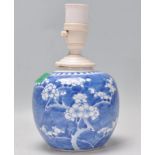 A 19th Century Chinese blue and white ginger jar being hand painted in the prunus pattern, being