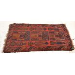 A good vintage 20th Century hand woven floor rug / runner having red ground with geometric