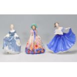 A group of three Royal Doulton ladies to include Hilary HN 2335, Easter Day Rd No. 842489 and Elaine