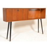A retro mid century century teak wood cabinet on legs. The tall dansette style legs in black with