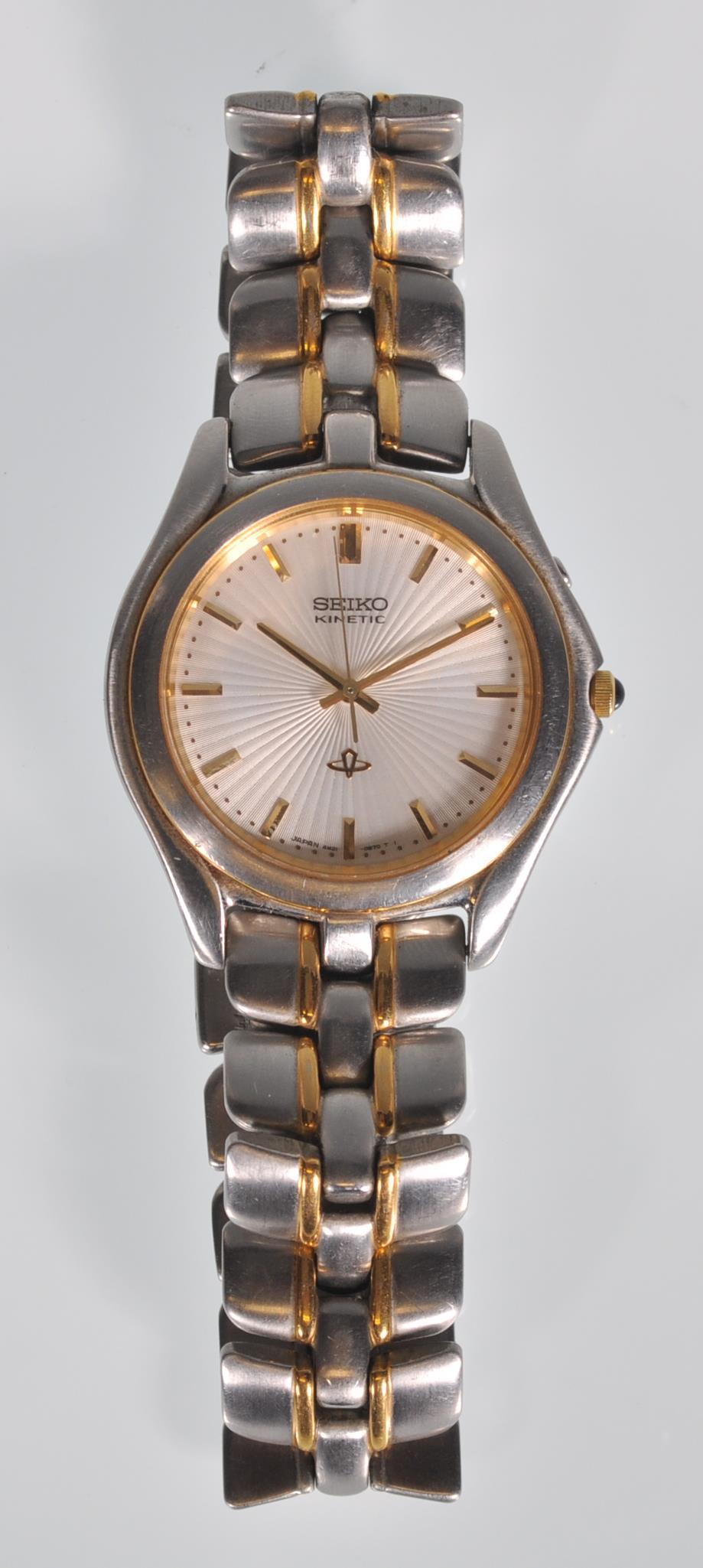 A gents Seiko Kinetic wristwatch having a textured silvered dial with gilt baton markers and hands
