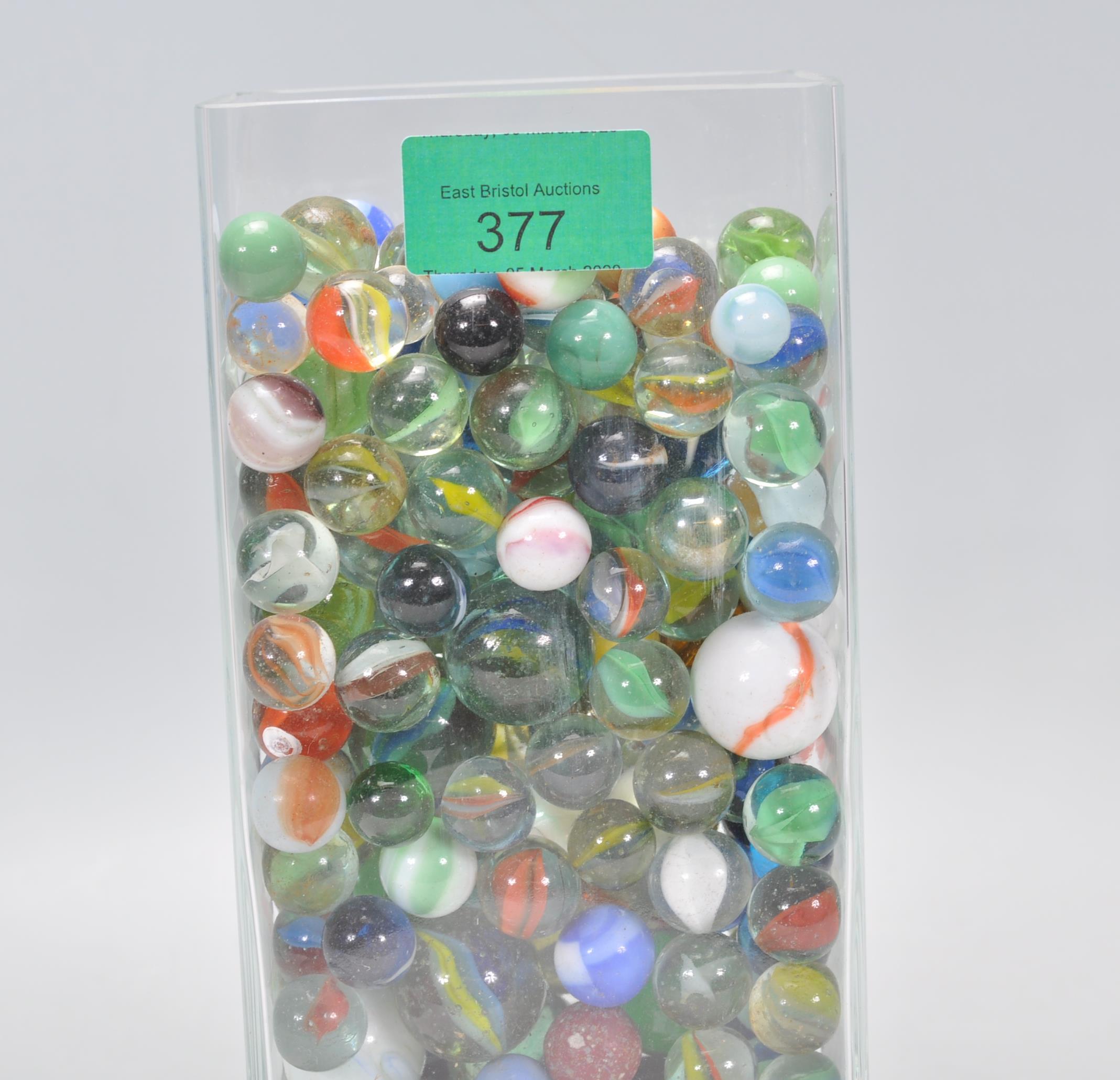 A collection of marbles to include glass cats eye marbles, some white and coloured glass examples, - Image 7 of 11