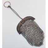 A 19th Century silver hallmarked penny / coin purse having a silver chain link body with silver