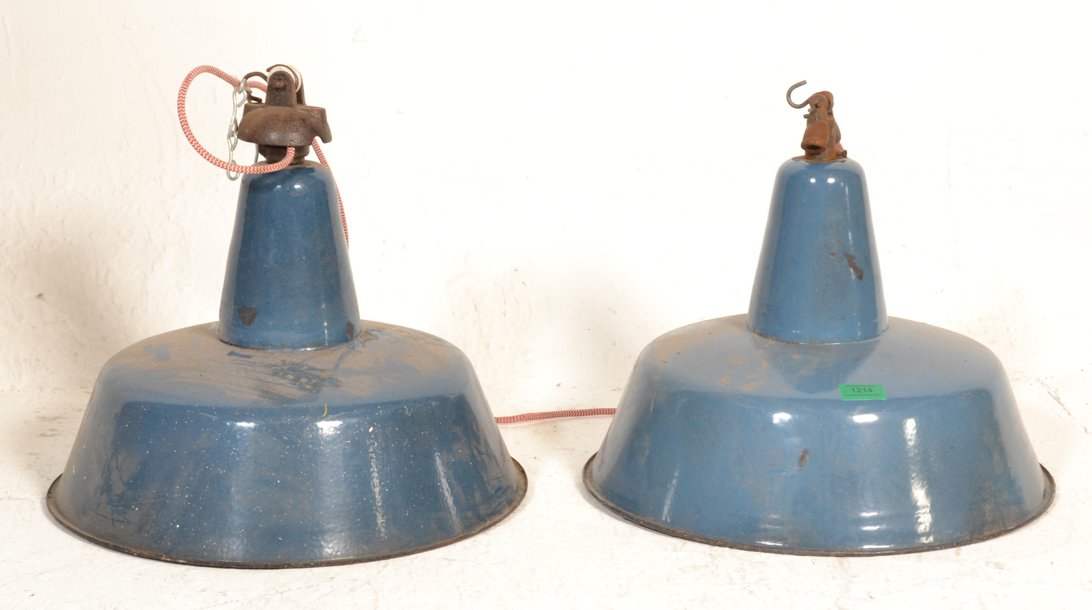 A pair of large Industrial factory enamelled metal ufo - space age pendant shades. Each in