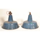 A pair of large Industrial factory enamelled metal ufo - space age pendant shades. Each in