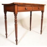A Victorian 19th century mahogany writing table desk being raised on ring turned legs with fitted