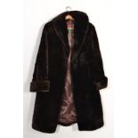 A vintage retro Royal Castor Beaver Lamb fur coat having brown satin lining and makers label, wide