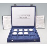 A collection of silver Legendary Aircraft Collection 50 dollar coins to include 19 silver coins of