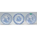 A group of three 18th Century Chinese blue and white plates decorated with precious objects, two