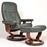 A contemporary Ekornes Stressless leather reclining armchair and matching ottoman footstool being