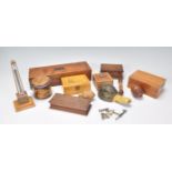 A collection of treen wares to include grater in the form of an acorn, table top boxes, painted