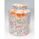 A large early 20th Century Chinese ginger jar of cylindrical form having hand painted floral sprays.
