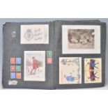 A charming album of of greeting postcards dating from the early 20th Century to include multiple