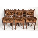 A set of 7 Victorian 19th century mahogany dining chairs being raised on turned legs with