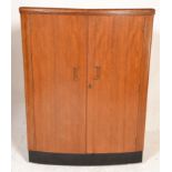 A mid century retro teak wood cocktail drinks bar by Turnidge having an ebonised plinth base with