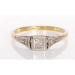 A stamped 18ct gold and platinum Art Deco ring having a square head set with a round cut diamond.
