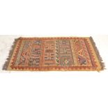 A good vintage 20th Century hand woven floor rug / runner having cream ground with red, blue and