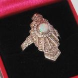 A silver cubic zirconia and opal panelled Art Deco style dress ring. Gross weight 7.7 grams. Size