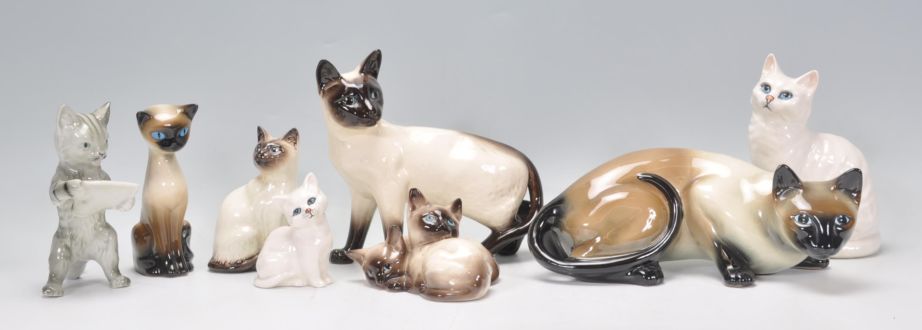 A group vintage 20th Century Beswick ceramic cats to include Siamese cat examples, Persian cats etc.