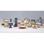 A collection of 20th Century motto ware / Devon ware to include candlestick holder,  a chamberstick,