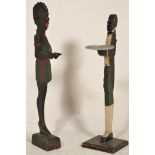 A pair of 20th Century free standing ashtrays / cardtray stands modelled after blackamoor