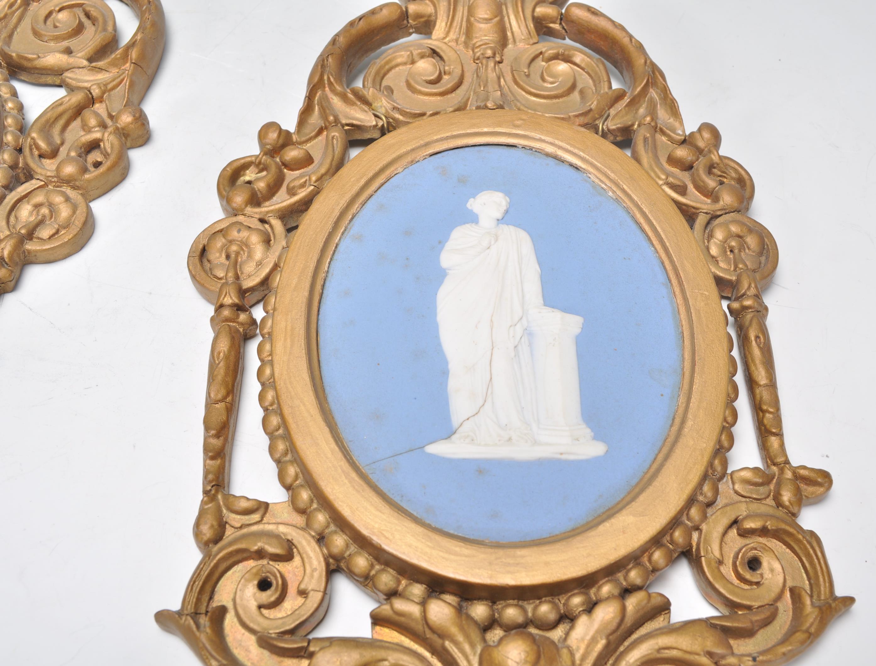 A pair of 19th century Wedgwood cameo plaques inset with classical scholars to each on oval blue - Image 2 of 7