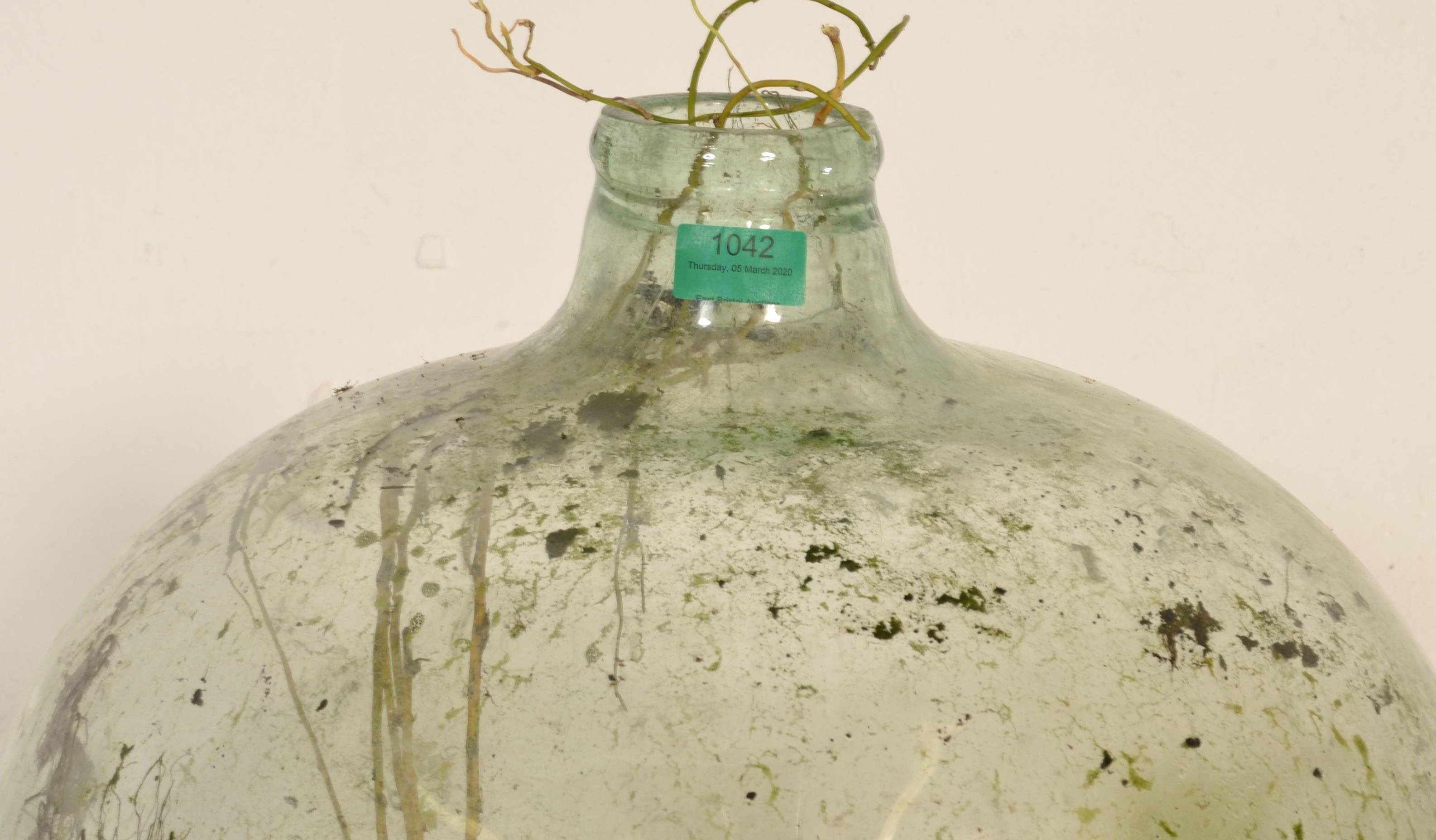 A vintage early 20th century large green glass acid carboy bottle  of globe form with waisted neck - Image 4 of 7