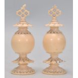 A good pair of 19th Century Victorian carved ivory ornaments / chess pieces having a pierced finials