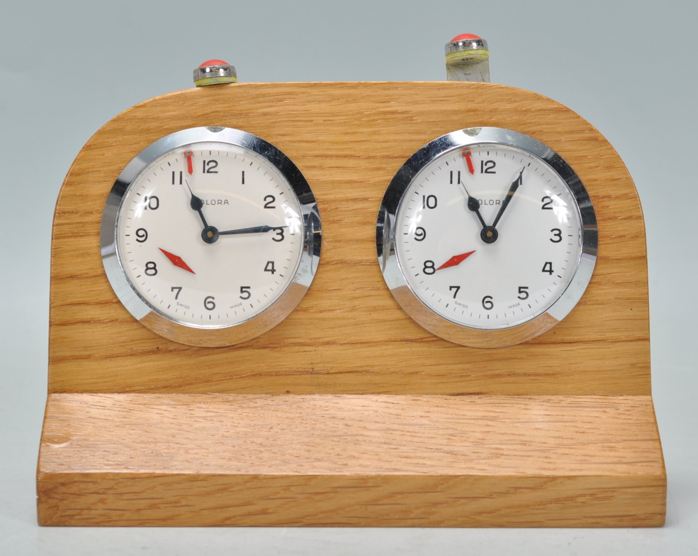 A rare vintage Solora swiss made chess clock / timer being oak cased with two clock faces having