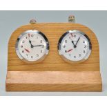 A rare vintage Solora swiss made chess clock / timer being oak cased with two clock faces having