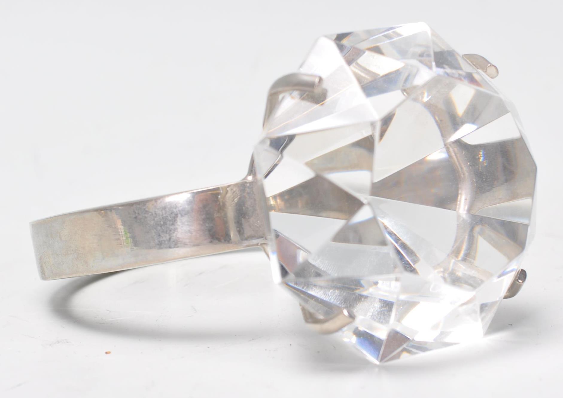 A large 20th century shop display silver plated and cut glass single stone ring with facet cut glass