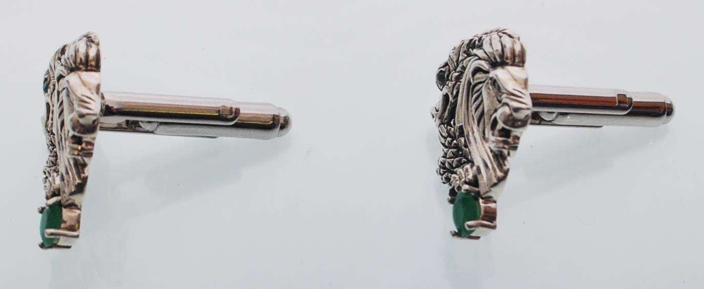 A pair of sterling silver cufflinks decorated with dragon and lions heads inset with jade style - Image 3 of 4
