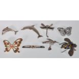 A good group of seven vintage animal / bug brooches to include two dolphin examples one having a