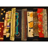 A collection of ten vintage silk neck scarves to include, Biba, Helena Rubinstein, Nina Ricci,