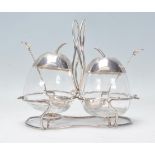A 20th century designer silver plated unusual table cruet set each in the form of apples being set