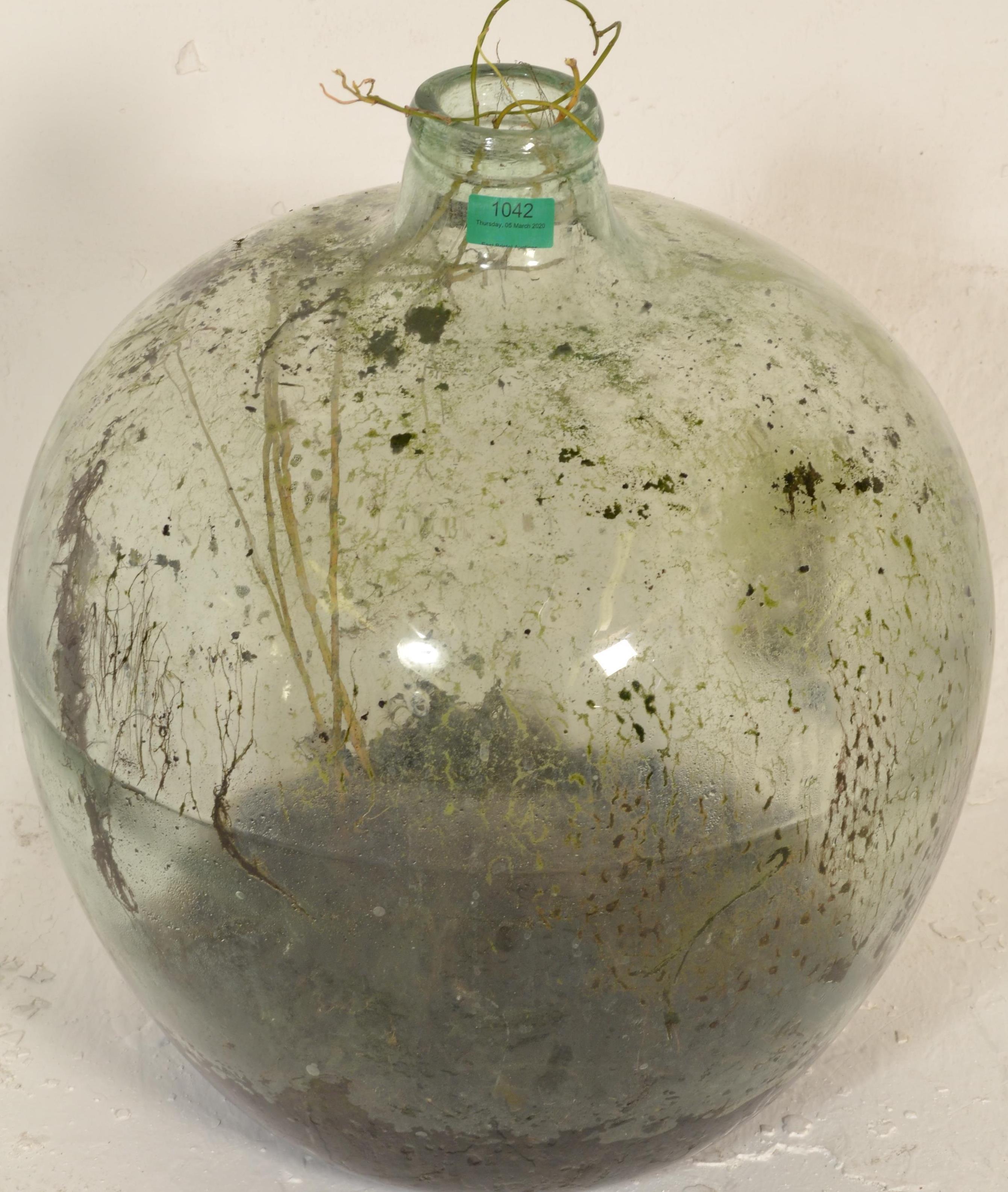 A vintage early 20th century large green glass acid carboy bottle  of globe form with waisted neck - Image 5 of 7