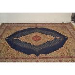 A 20th century Persian / Islamic floor rug with foliate geometric spandrels having beige ground with