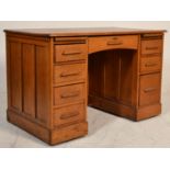 A early 20th Century 1920's Industrial Air Ministry style oak twin pedestal office desk having a