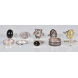 A collection of stamped ladies silver rings to include a Tiffany & Co signet ring, a green stone