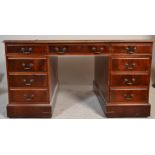A large Victorian style mahogany and leather twin pedestal office desk. Raised on plinth pedestal