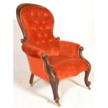 A Victorian 19th century mahogany spoon back armchair. Raised on cabriole legs with overstuffed seat