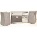 A retro 20th century Sharp Hi-Fi system in silver with acrylic smoked turntable hood. Model No VZ-