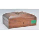 An early 20th Century carved oak trinket box of rectangular form having a hinged domed lid carved in