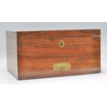 A 19th Century Victorian coromandel wood writing box of rectangular form with a hinged top and
