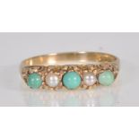 An English hallmarked 9ct yellow gold ladies dress ring set with turquoise style cabochons