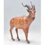 An unusual 20th century leather figurine of an African bush buck antelope. Well detailed body with