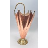 A 20th Century Arts and Crafts antique style hammered copper umbrella stand in the form of an